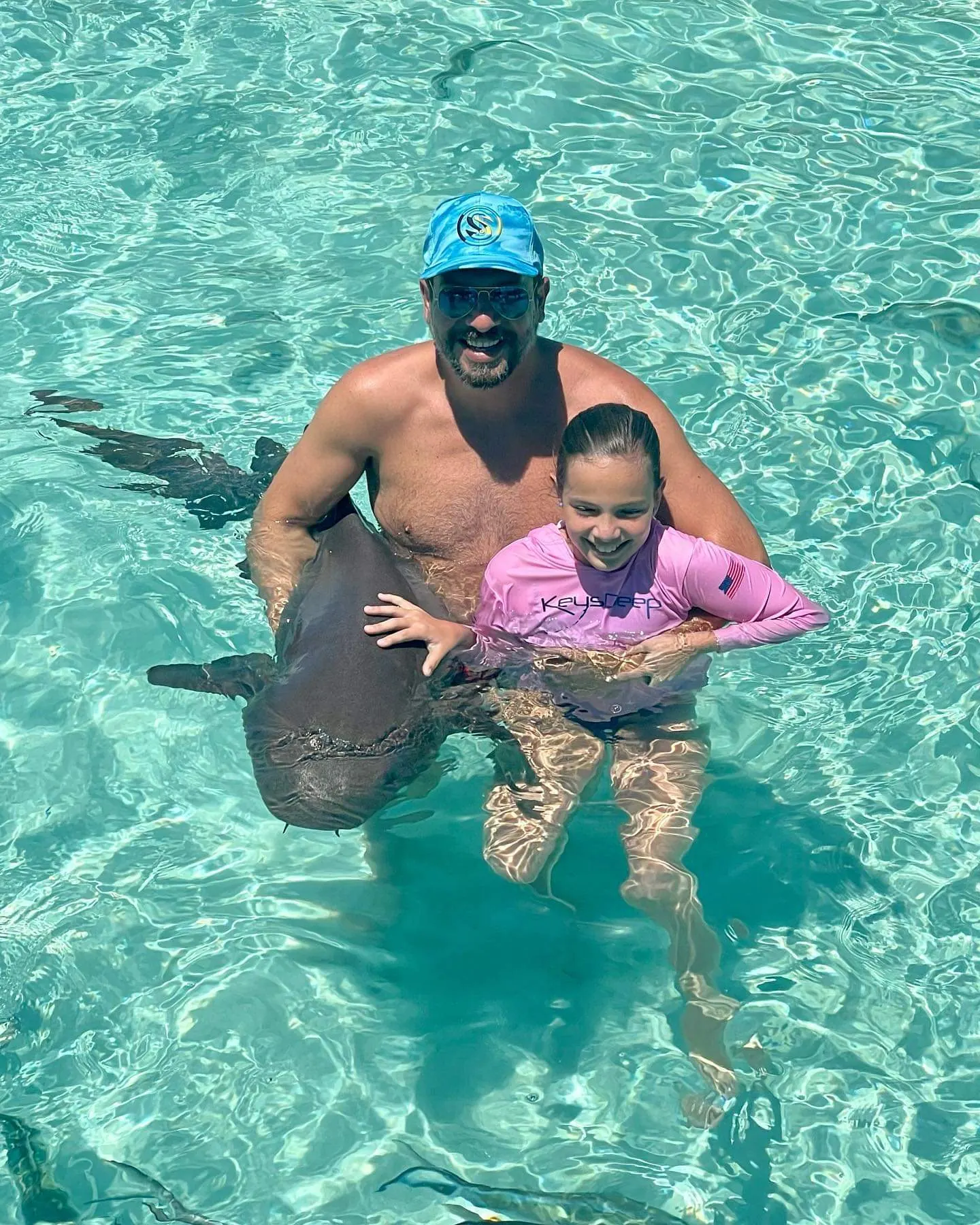 Nurse sharks in the crystal-clear shallows at Compass Cay Marina, Exuma